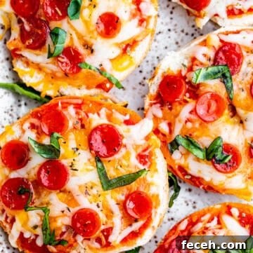 Overhead shot of bagel bites on white tray.