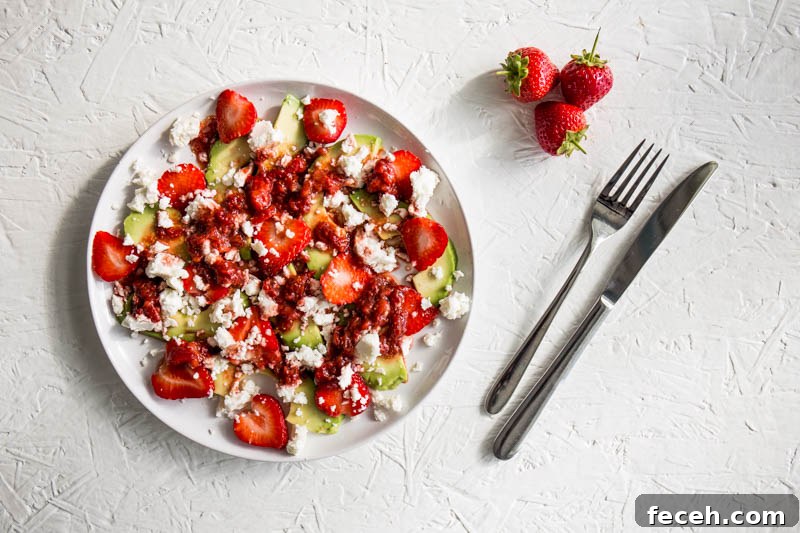 Sweet summery strawberries play against the tangy, metallic feta and the creamy avocado to make a delicious salad that’s ripe for any summer picnic or lunch table. Dressed with a rich strawberry and balsamic dressing, this vegetarian strawberry avocado salad is a beautifully fresh, easy to make dish that’s a perfect starter, side dish or salad.