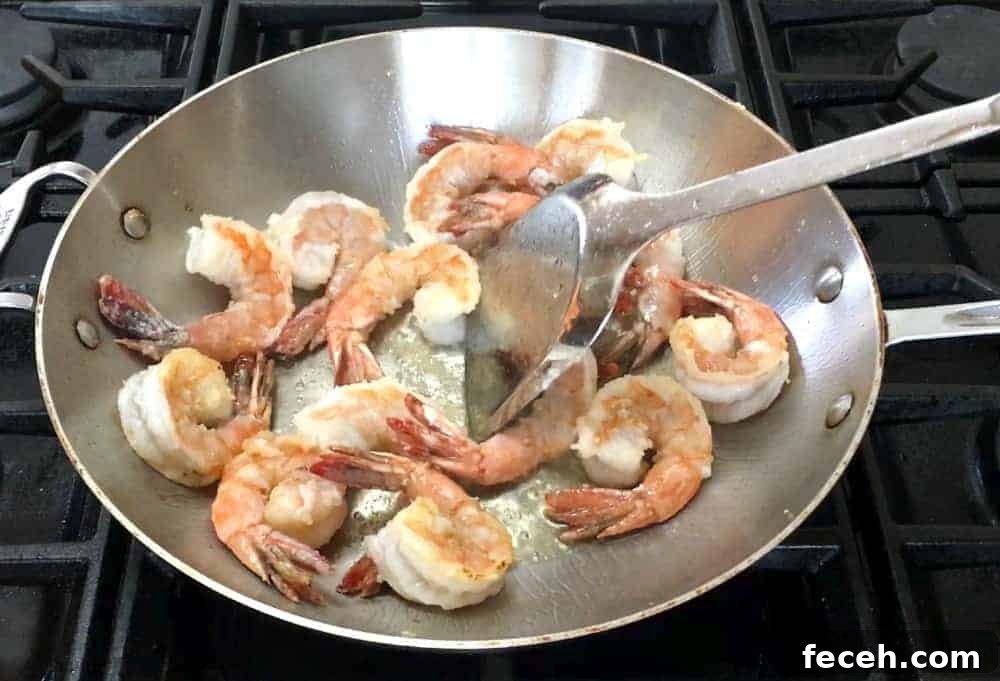 Crispy Salt and Pepper Shrimp Recipe with Garlic and Chili 9 Stir Frying Shrimp until Crisp