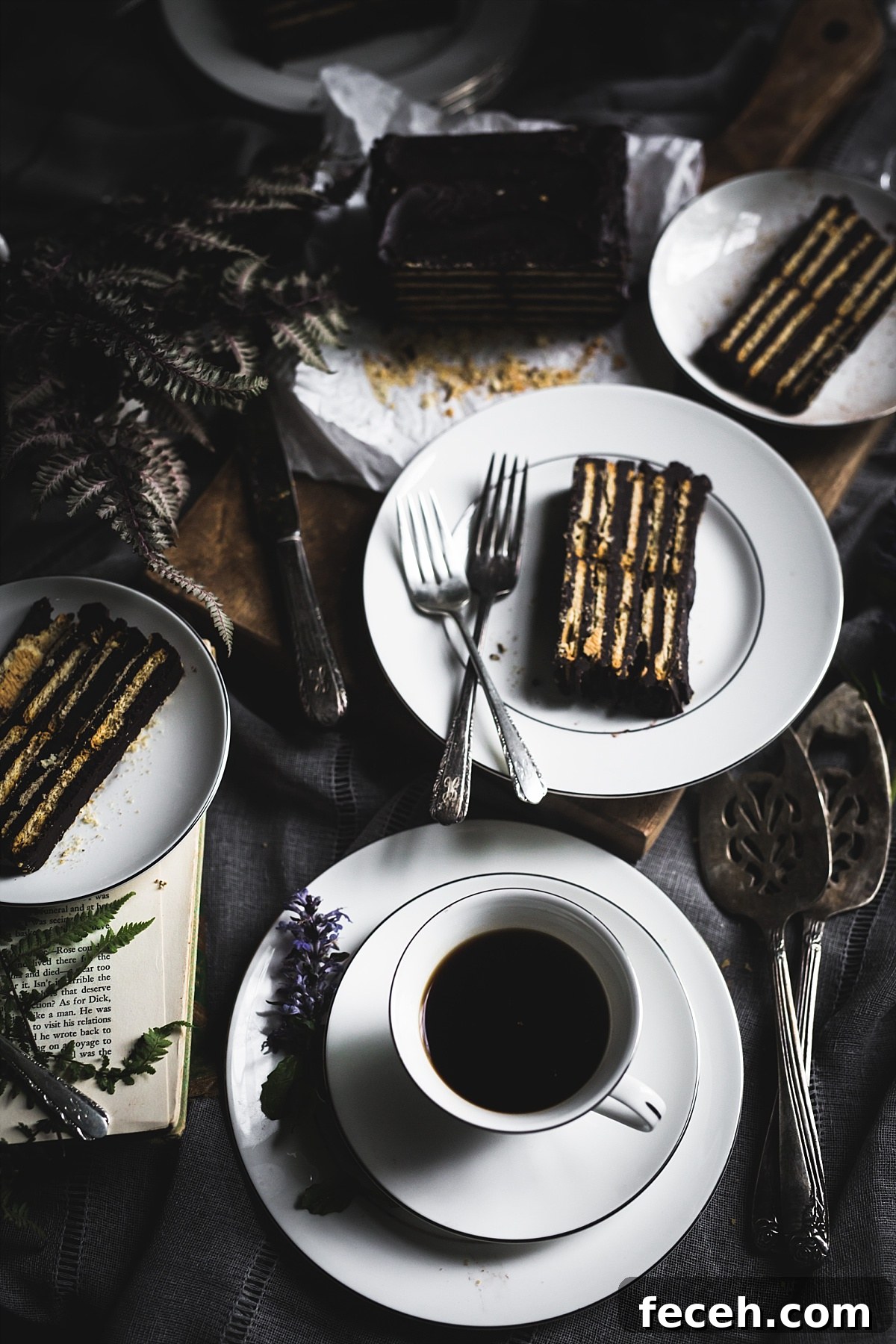 Kalter Hund Recipe: Authentic German No-Bake Chocolate Biscuit Cake 2 Three plates each with a slice of Kalter Hund and a coffee cup on a saucer.