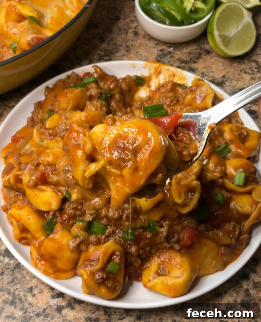 Cheesy Taco Tortellini Skillet -> Taco Tortellini Skillet with Melty Cheese and Taco Flavor 3 Cheesy Taco Tortellini Skillet