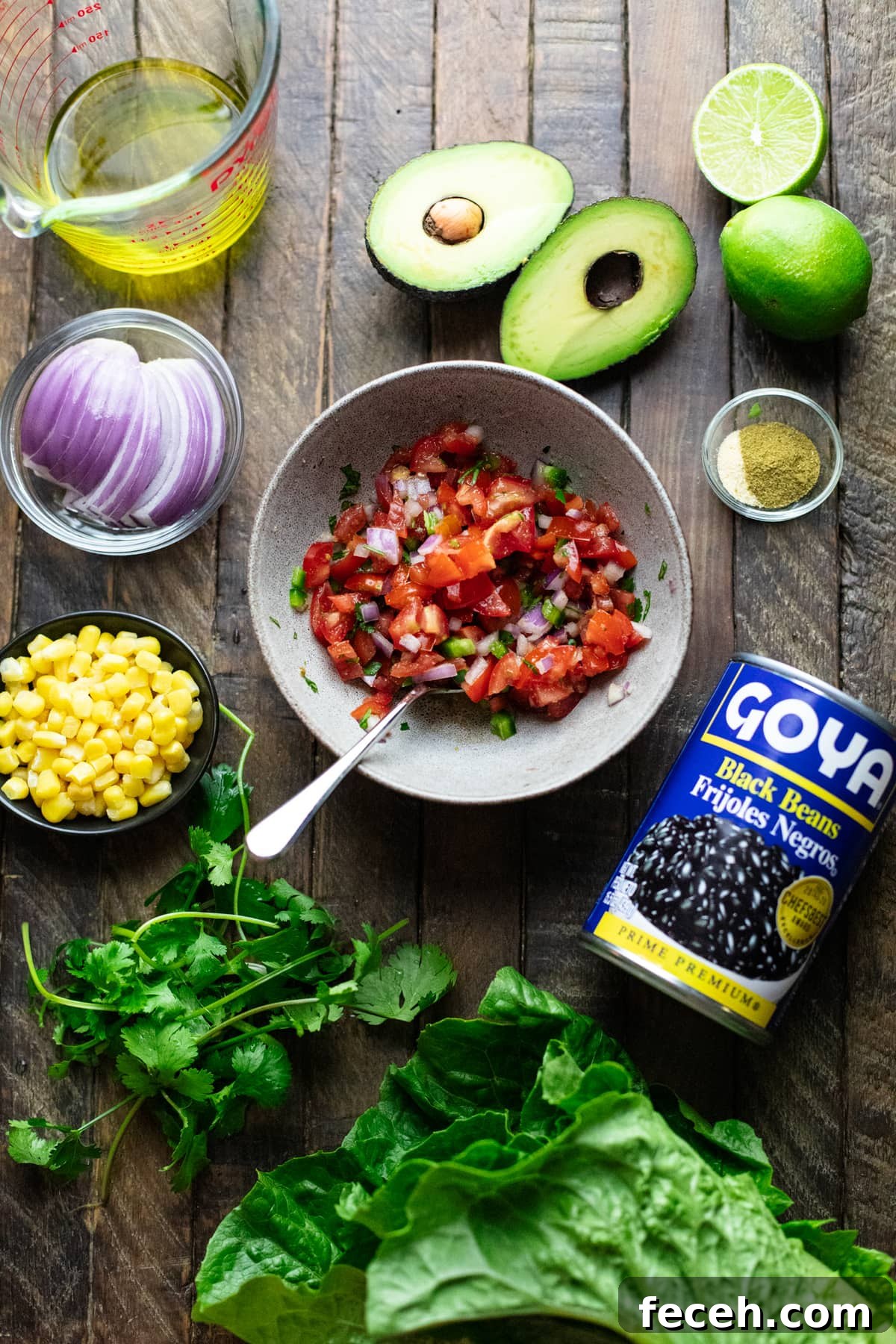 Vegetarian Taco Salad with Cilantro-Lime Dressing Recipe 3 Ingredients for vegetarian taco salad arranged on wooden background.