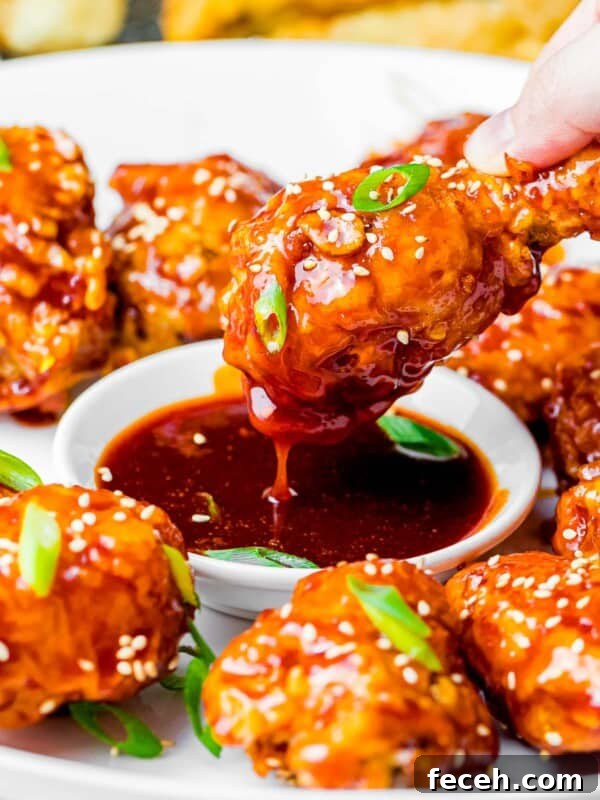 crunchy Korean fried chicken wings dipped into a sweet and spicy gochujang sauce