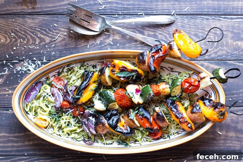 Grilled Veggie and Halloumi Skewers with Lemon Herb Marinade 3 Skewers of potatoes, peppers, onions, zucchini, tomatoes, and halloumi over garlicky zoodles.