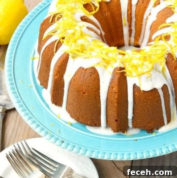 Lemon Cream Cheese Pound Cake Recipe with Zesty Glaze 2 Lemon cream cheese pound cake on a cake stand
