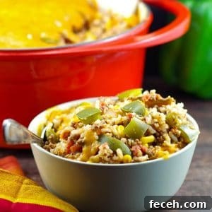 WW-Friendly Stuffed Green Pepper Casserole Recipe 11 bowl of ww stuffed green pepper casserole in front of a orange casserole dish in background