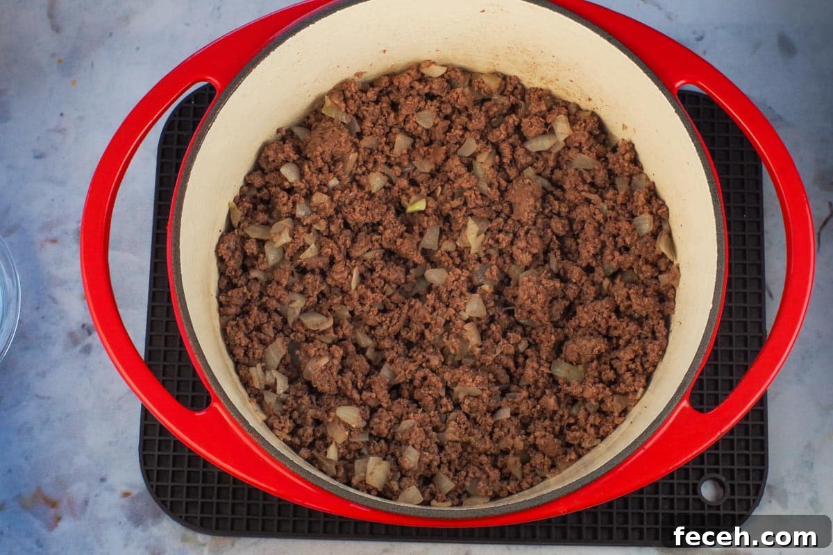 WW-Friendly Stuffed Green Pepper Casserole Recipe 5 ground beef and onion cooked in an orange dutch over.