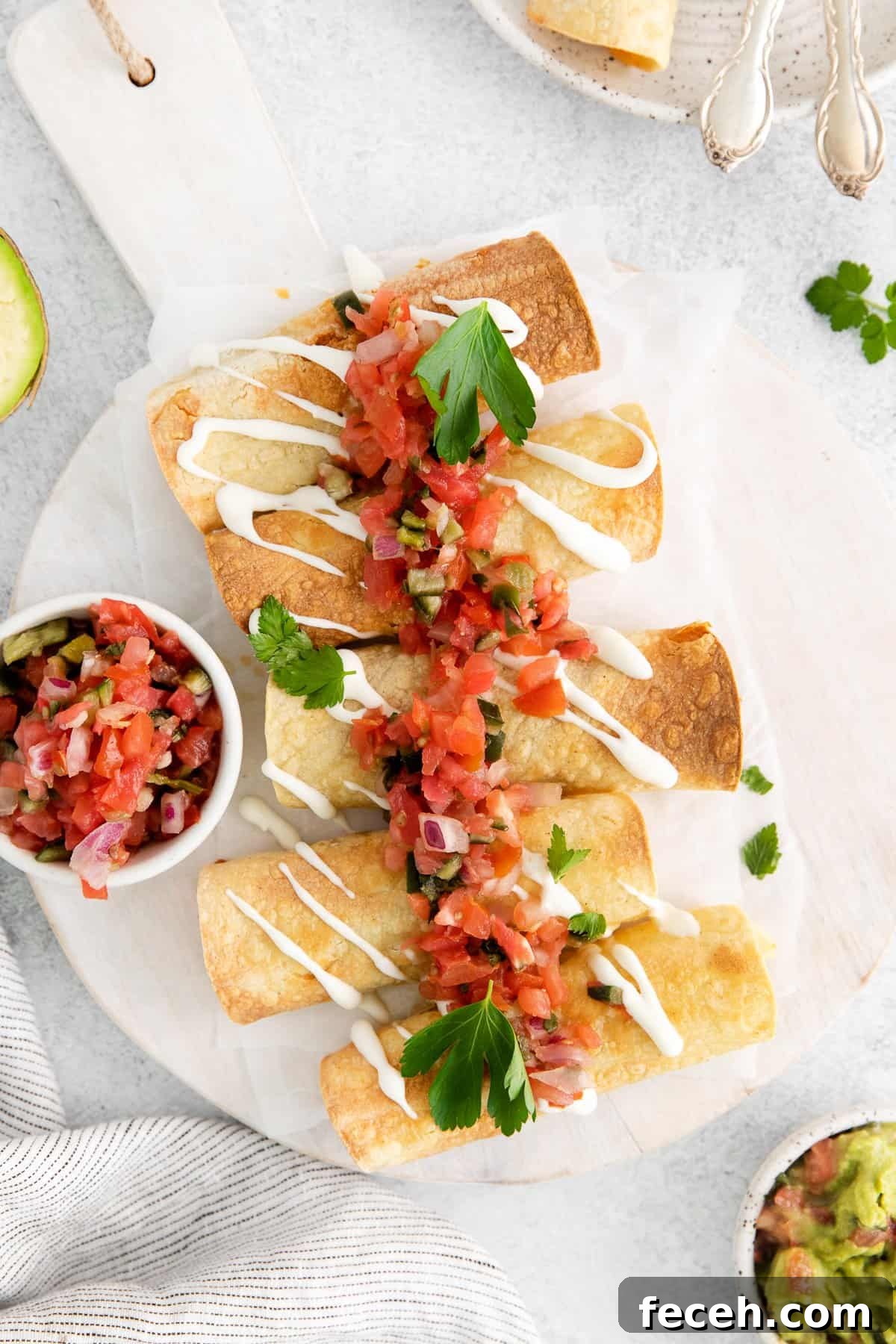 Cheese and beef taquitos topped with pico de gallo.