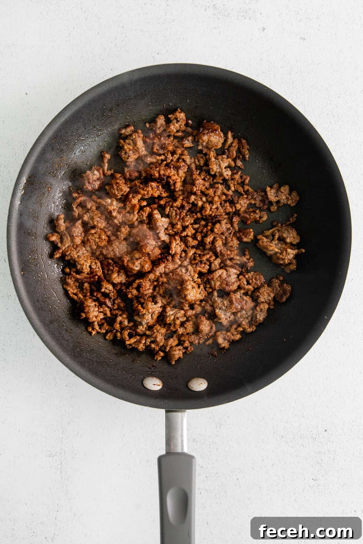 Ground beef in a skillet.