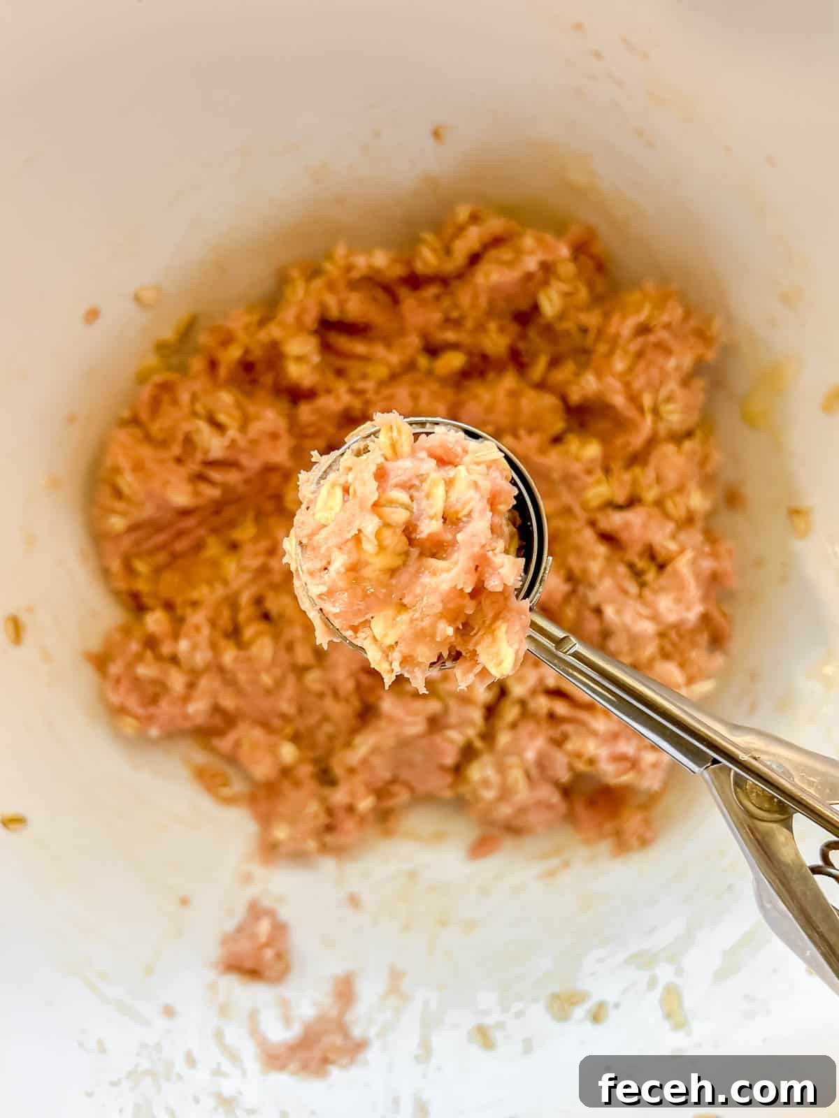Gluten-Free Baked Turkey Meatballs Recipe 5 Scooping the mixture into meatballs.