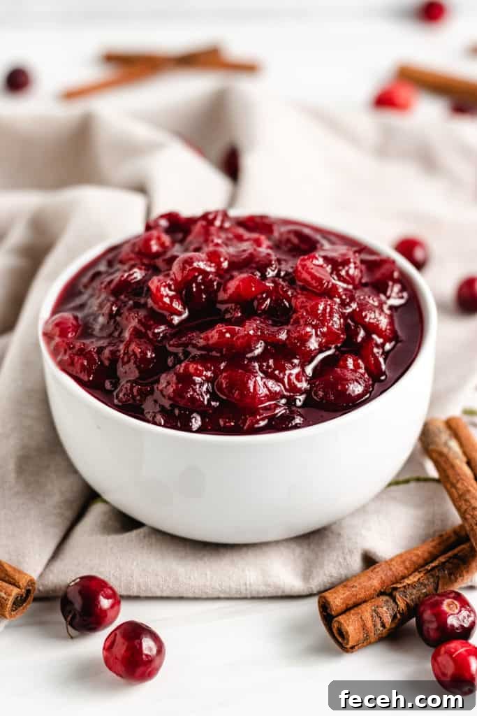 White dish filled with homemade cranberry sauce.