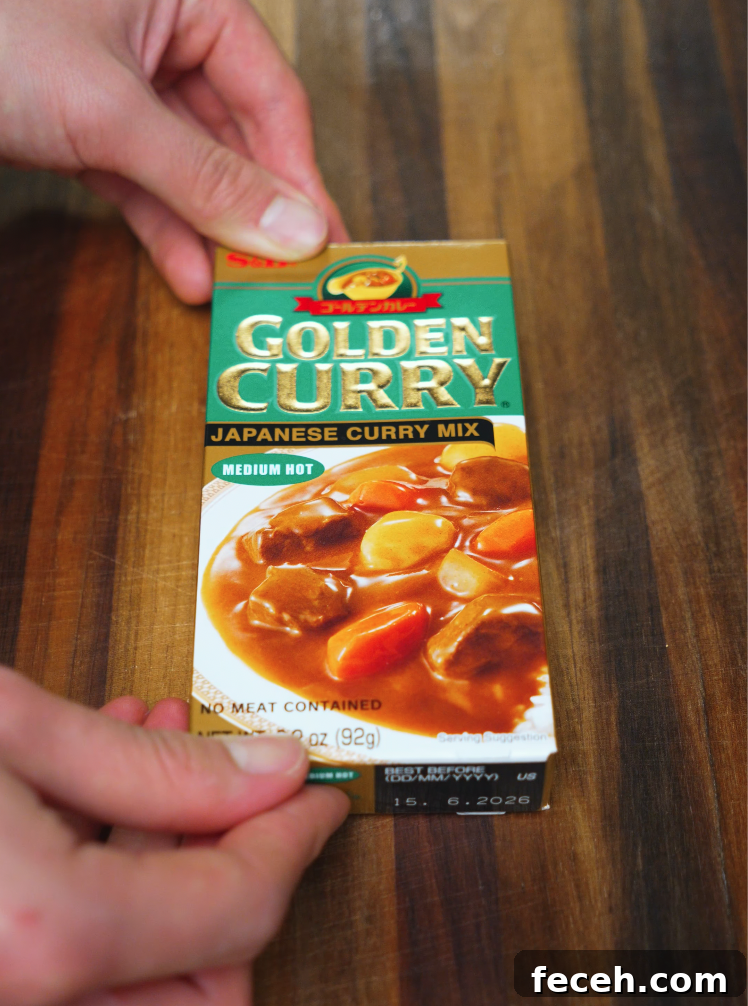 Japanese Chicken Katsu Curry Recipe: Crispy Cutlet with Savory Sauce 6 Box of Golden Curry Japanese Curry Mix on wooden table – commonly used base for easy homemade chicken katsu curry.