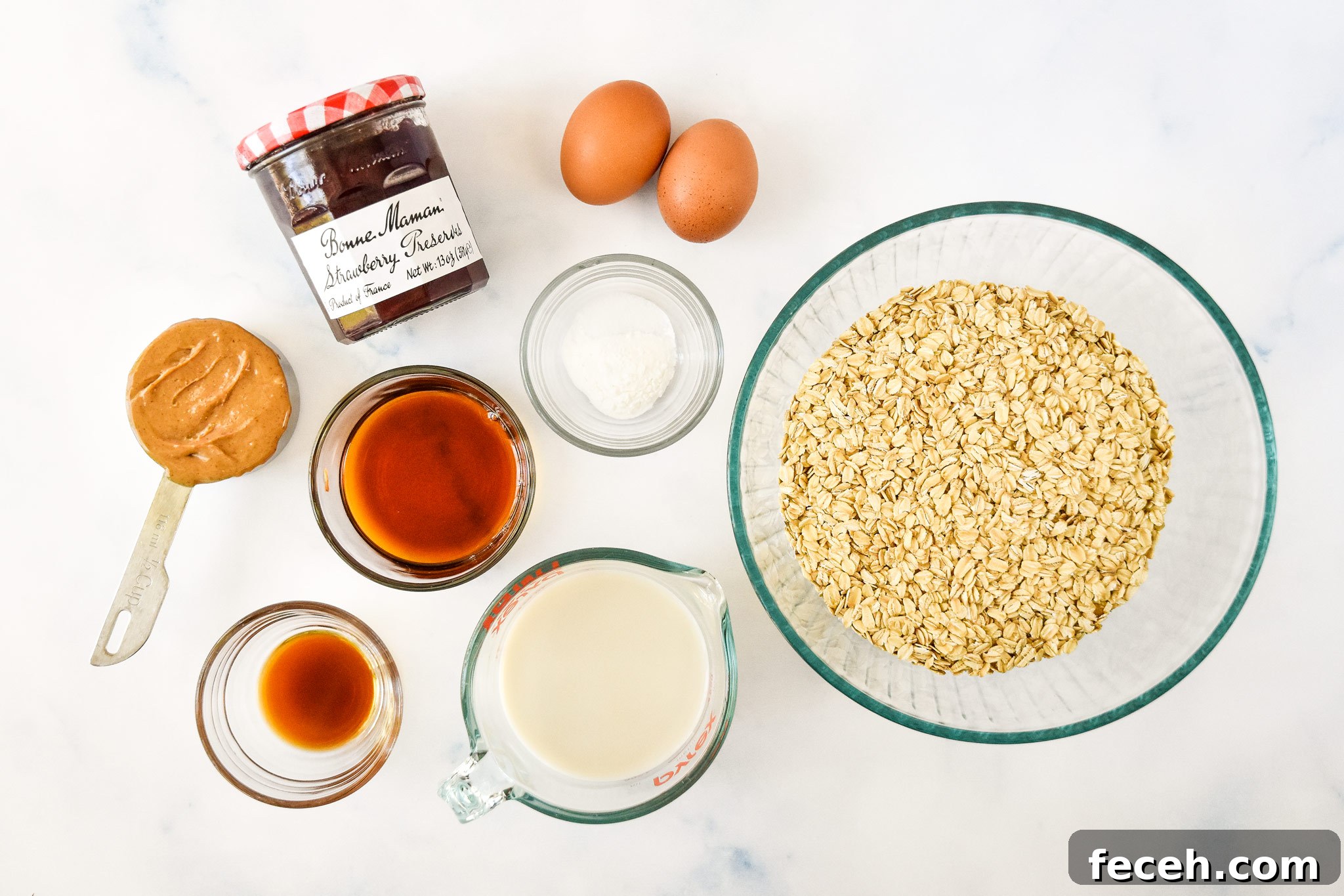 ingredients on a counter top for the pbj baked oatmeal cups.