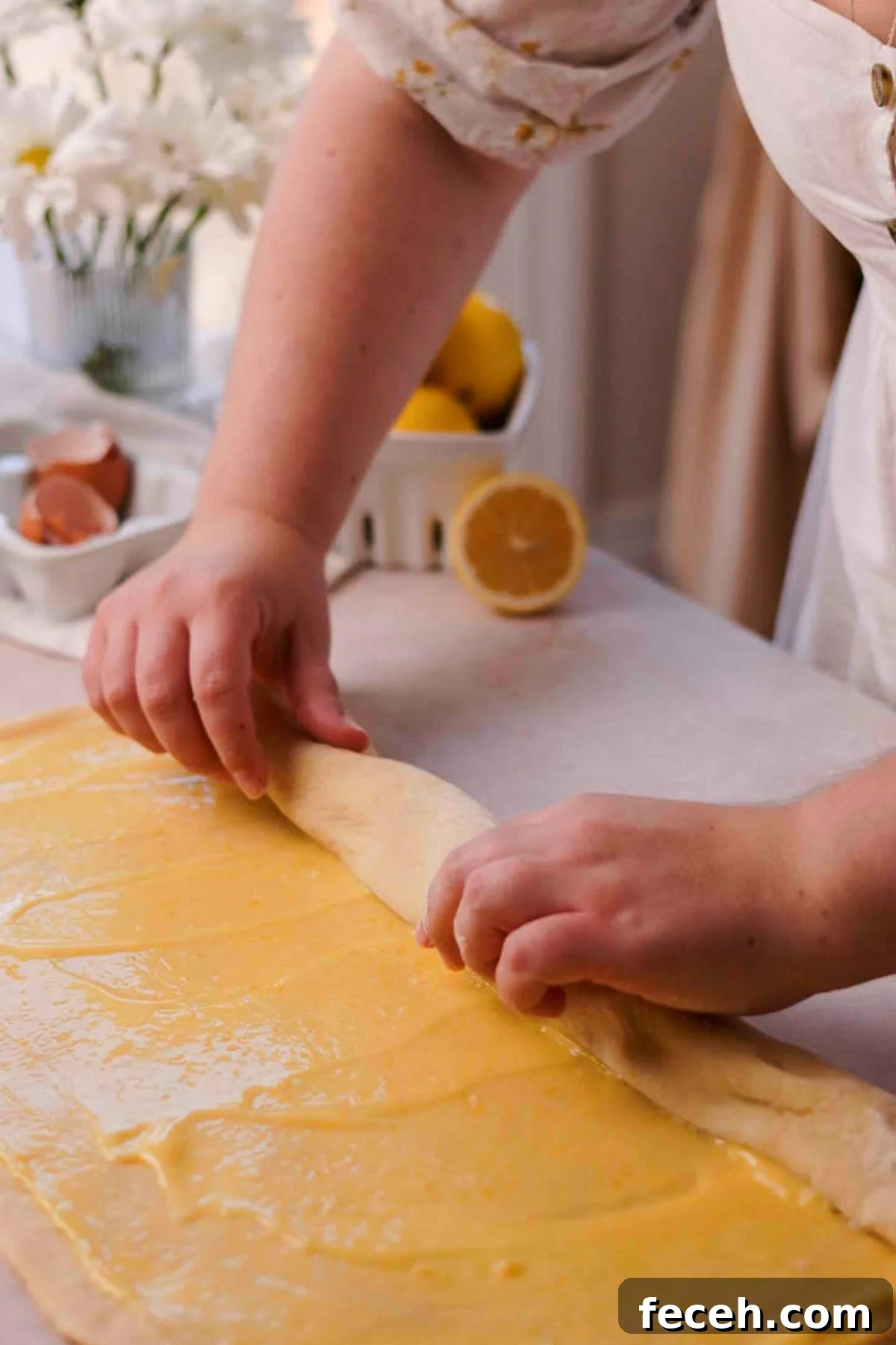 rolling up the filled lemon rolls