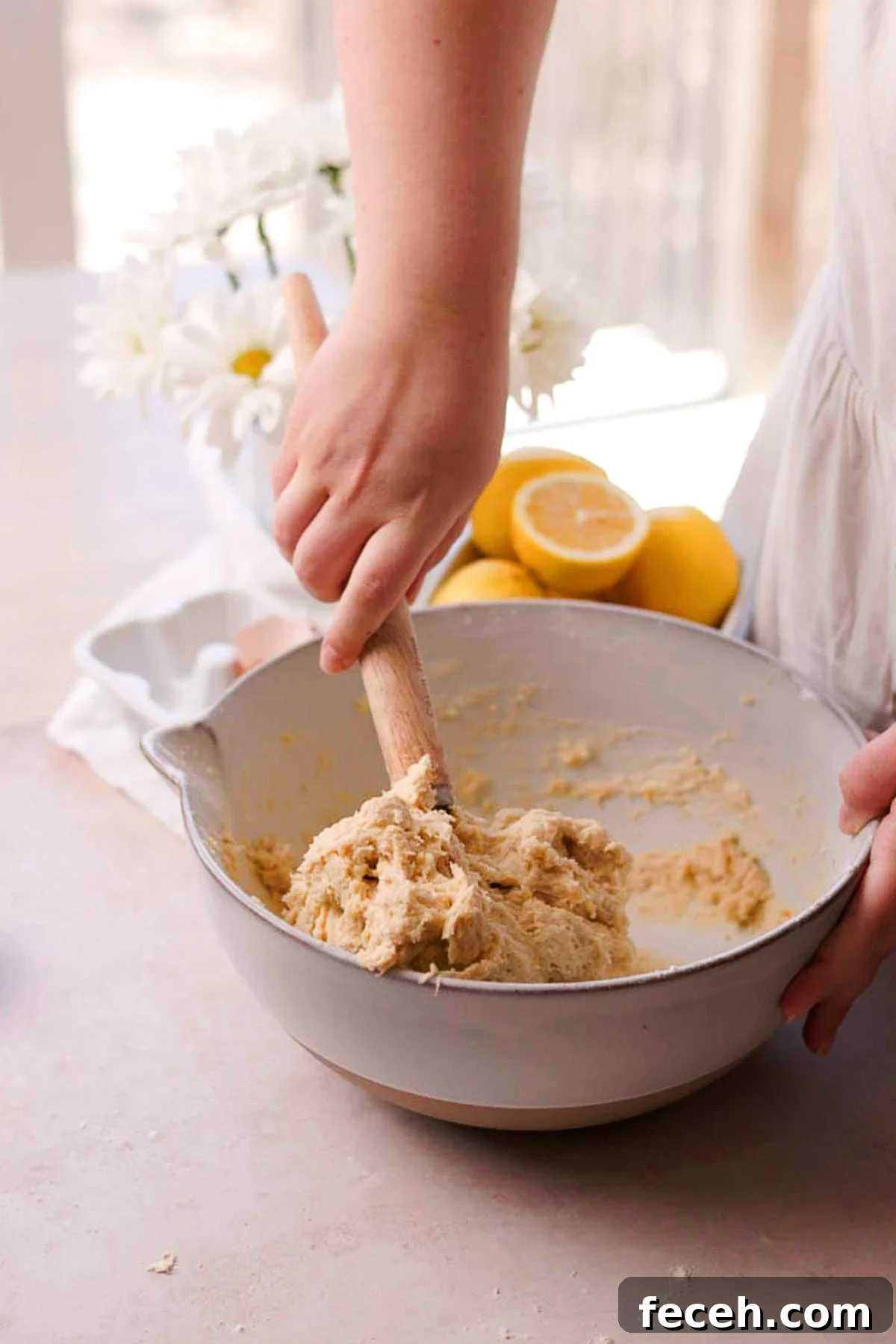 mixing the roll dough together with a danish whisk by hand