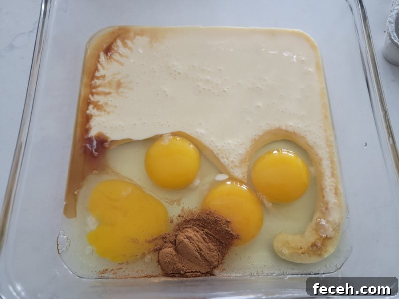 Eggnog French Toast ingredients in a glass pan