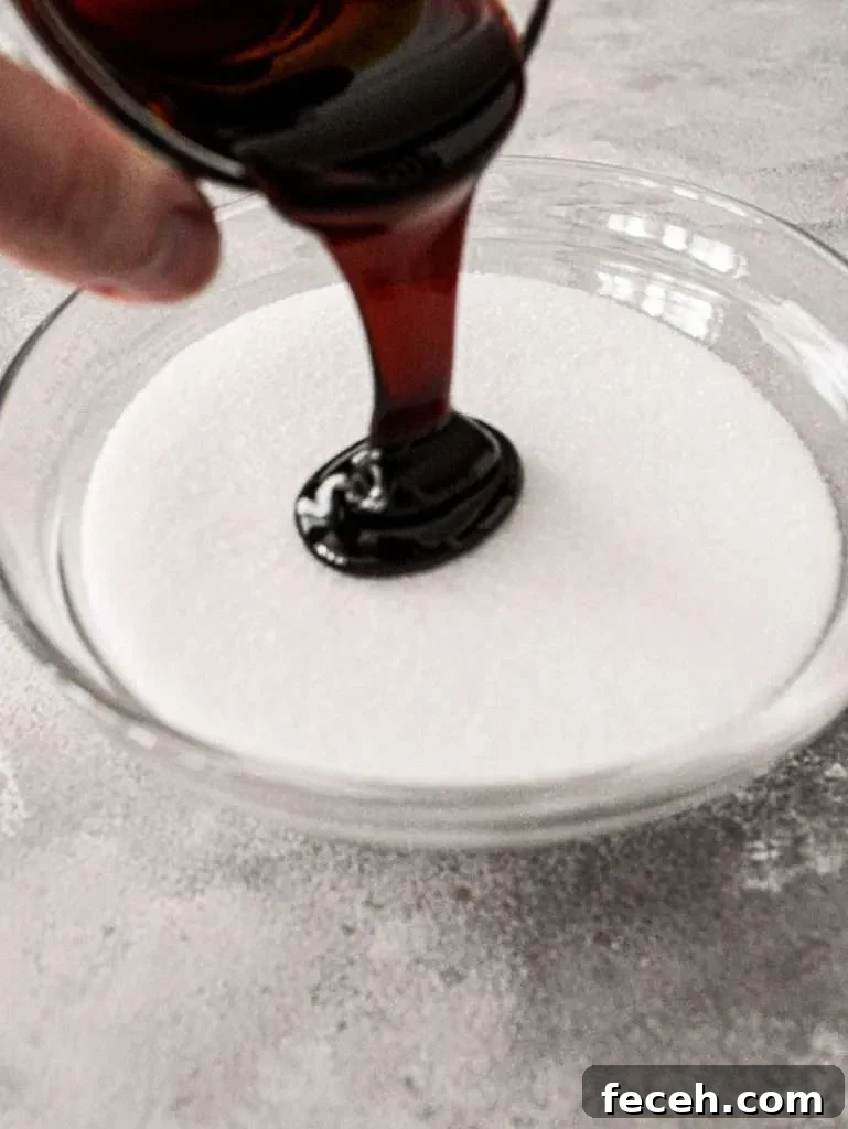 brown sugar pouring molasses into bowl with granulated sugar