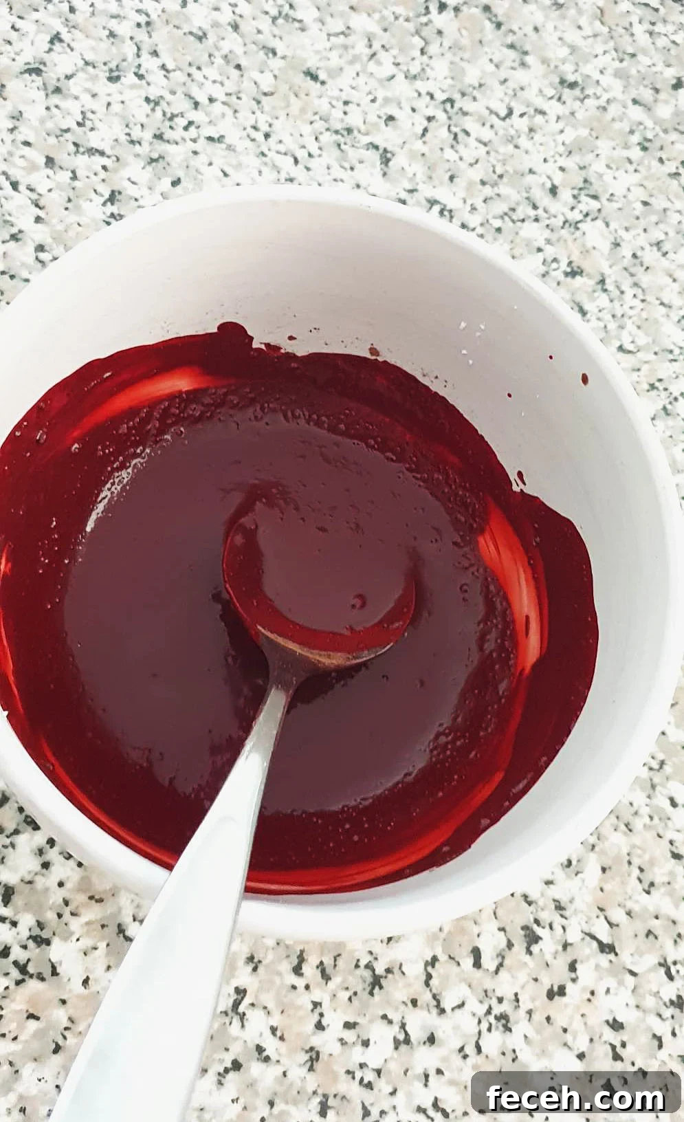red food colouring a cocoa powder mixed together.