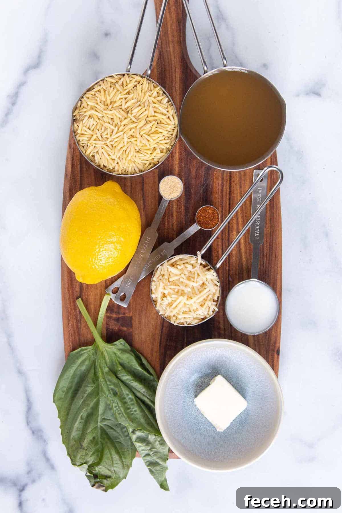 Lemon parmesan orzo ingredients: orzo pasta, chicken broth, fresh lemon juice, lemon zest, fresh basil, butter, milk, parmesan, cayenne, garlic powder.