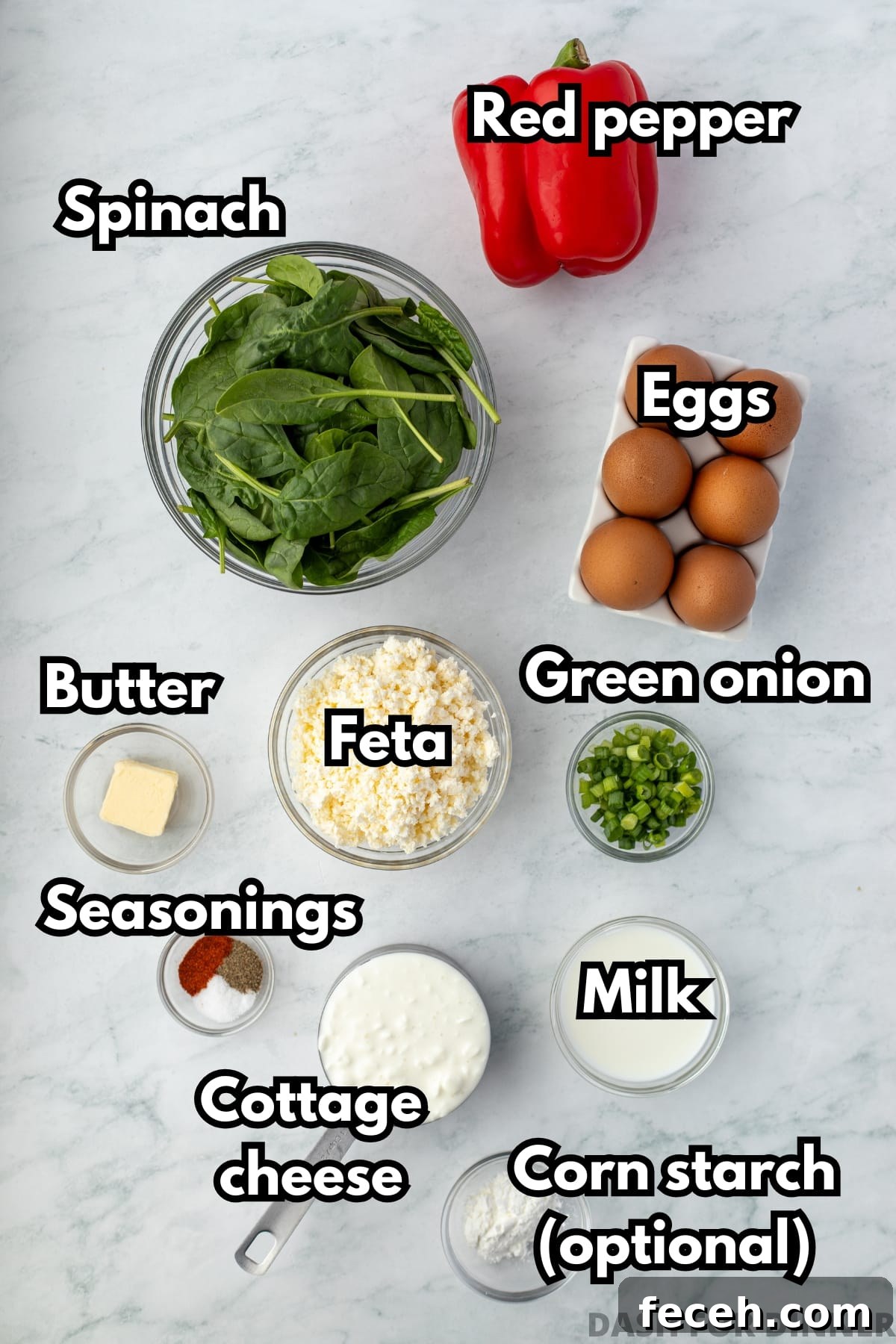 Mini Spinach and Feta Frittatas Recipe 3 The ingredients needed to make spinach mini frittatas, including eggs, cottage cheese, and red pepper.