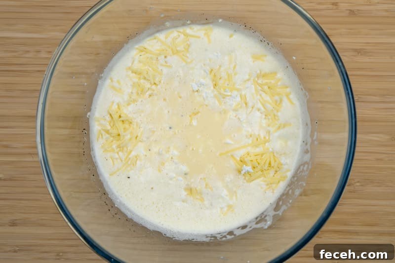 Stirring in the cheese