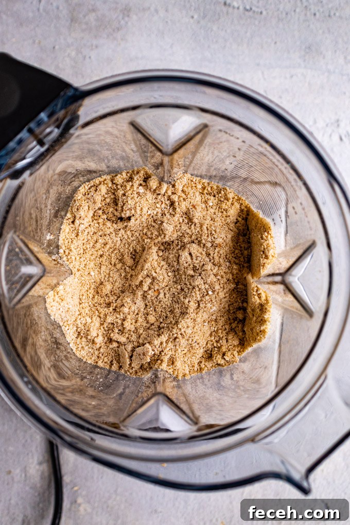 Overhead shot of crust ingredients blended into a fine meal.