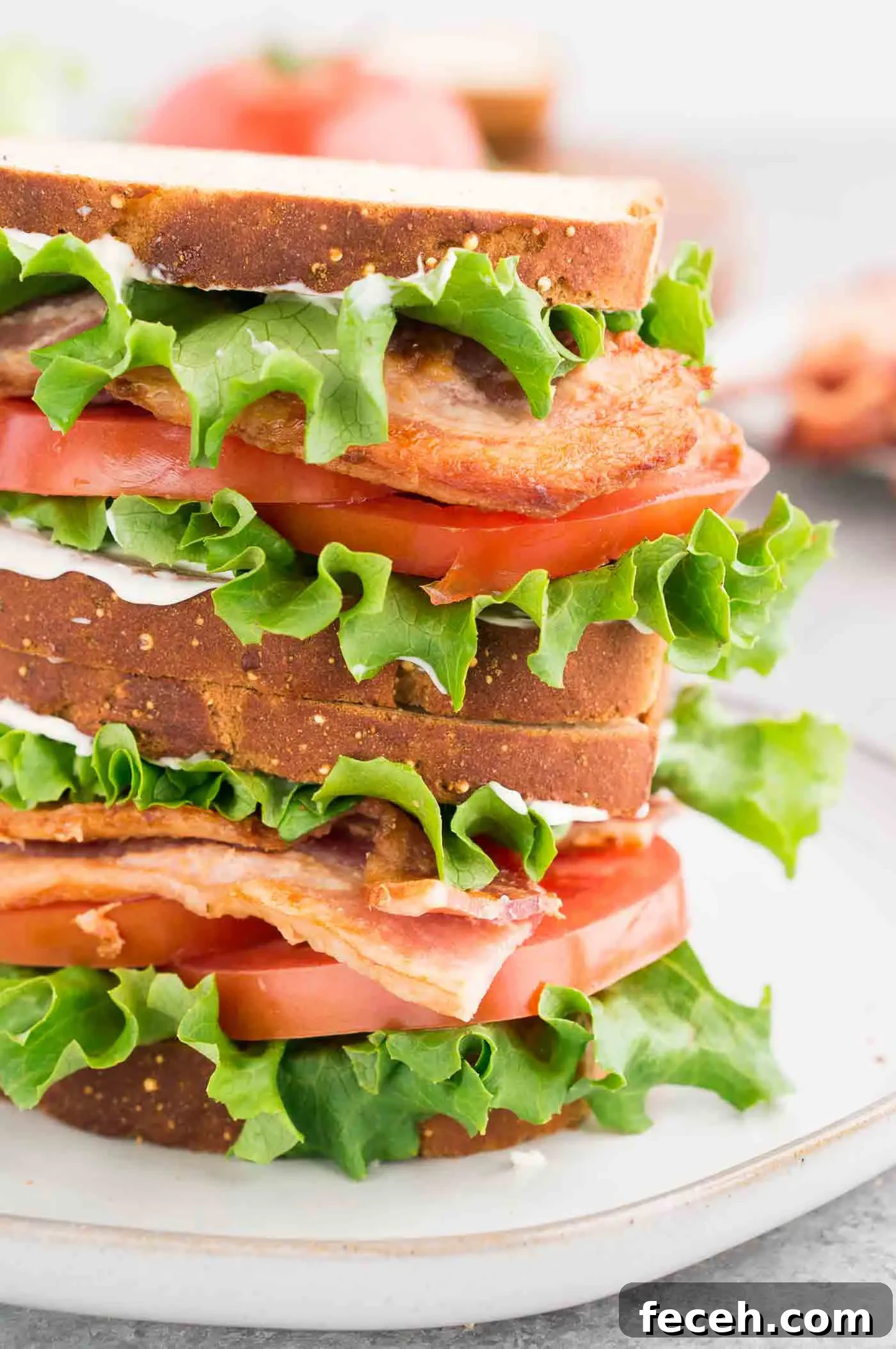 Classic BLT Sandwich Recipe: Crispy Bacon, Lettuce & Tomato 6 close up of stacked classic BLT sandwich