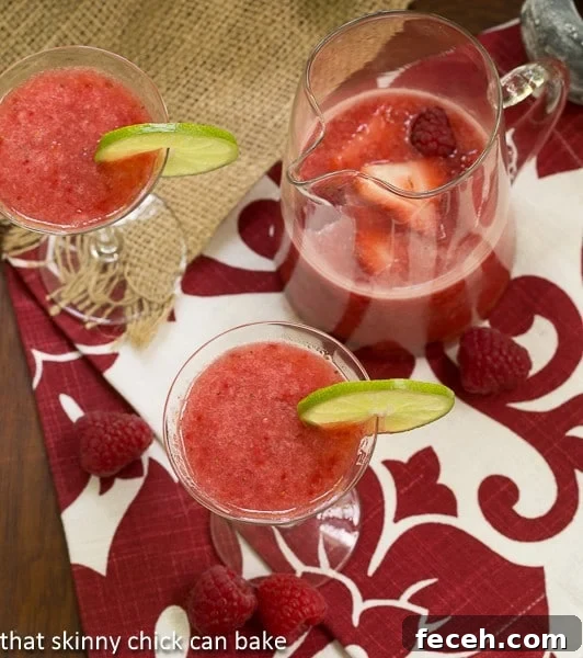 Overhead view Frozen Fresh Berry Daiquiris in glasses and in a pitcher