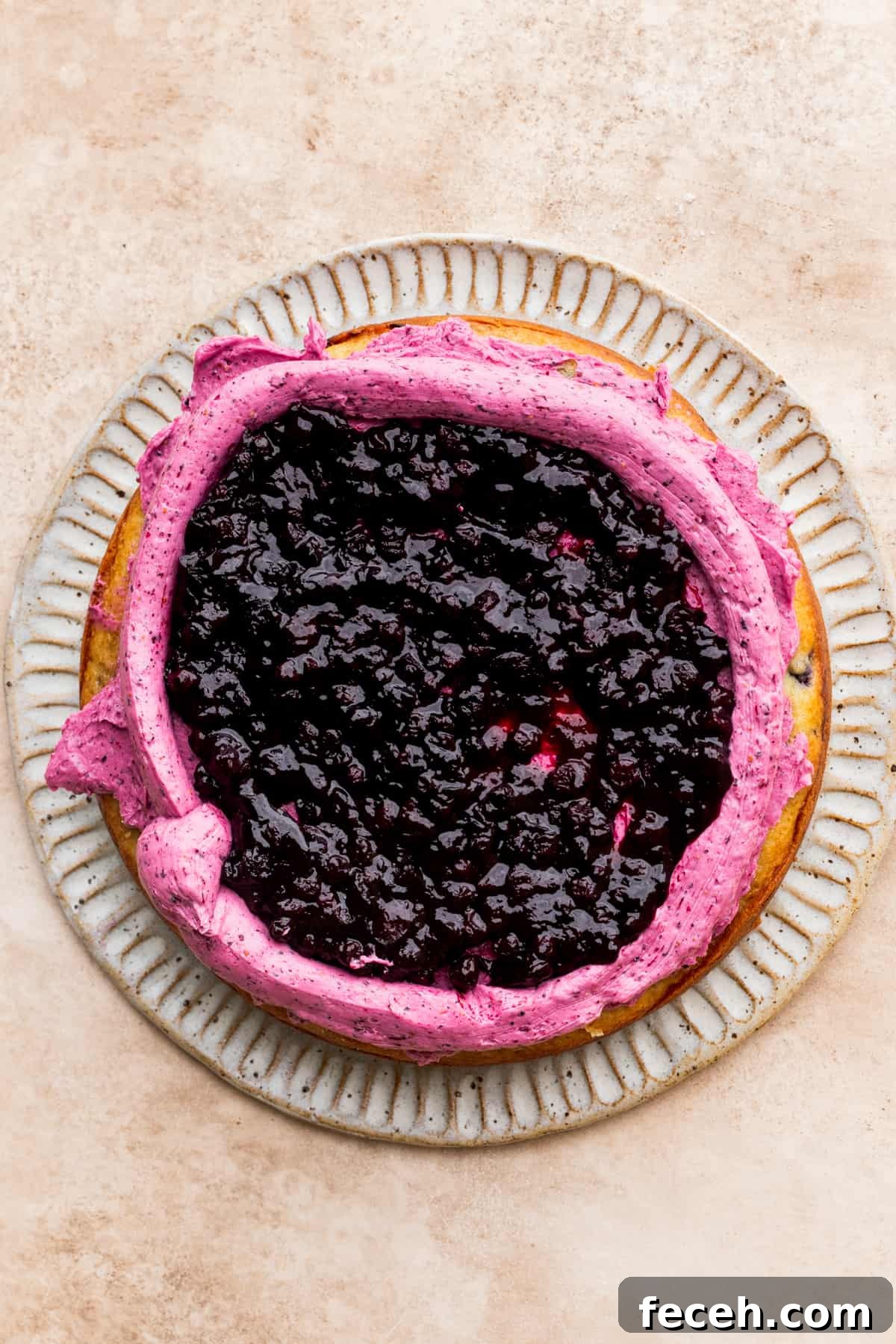 Blueberry sauce on top of the cake.