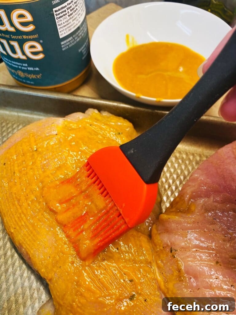 brushing turkey with mustard