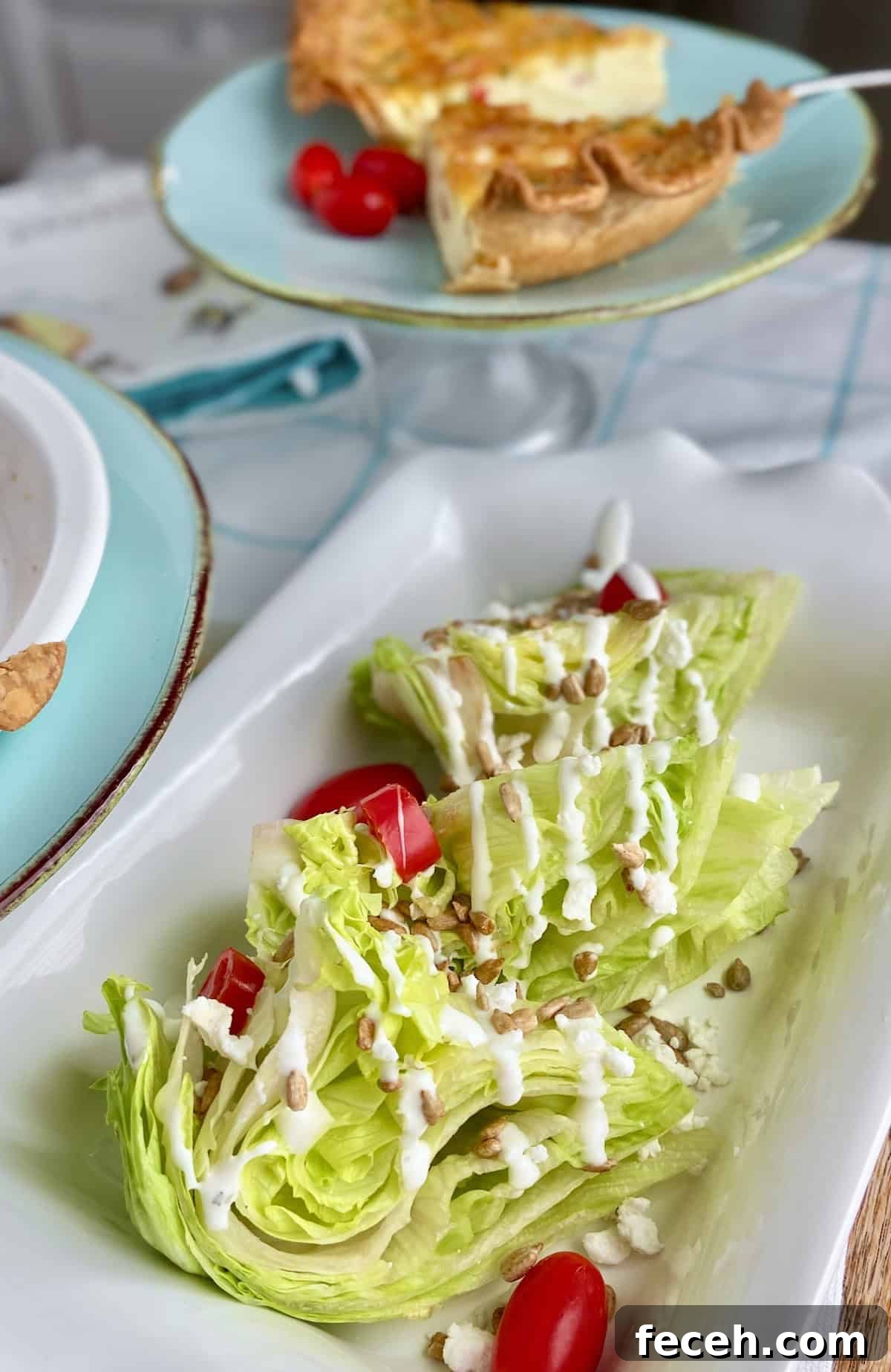 Wedge salad on white plate with buttermilk dressing.