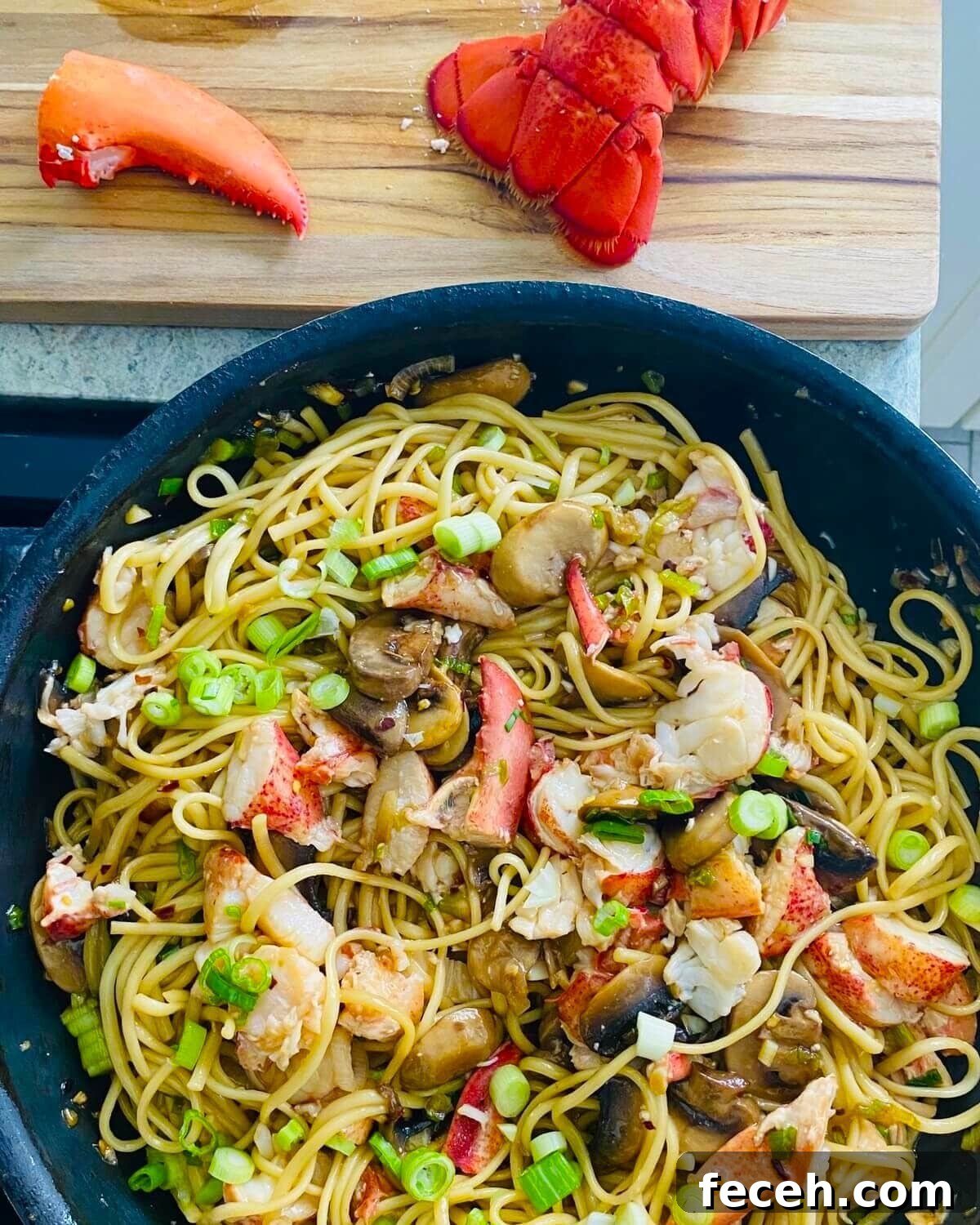 Lobster noodles on stovetop.