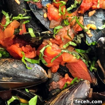 mussels cooked in a light marinara sauce