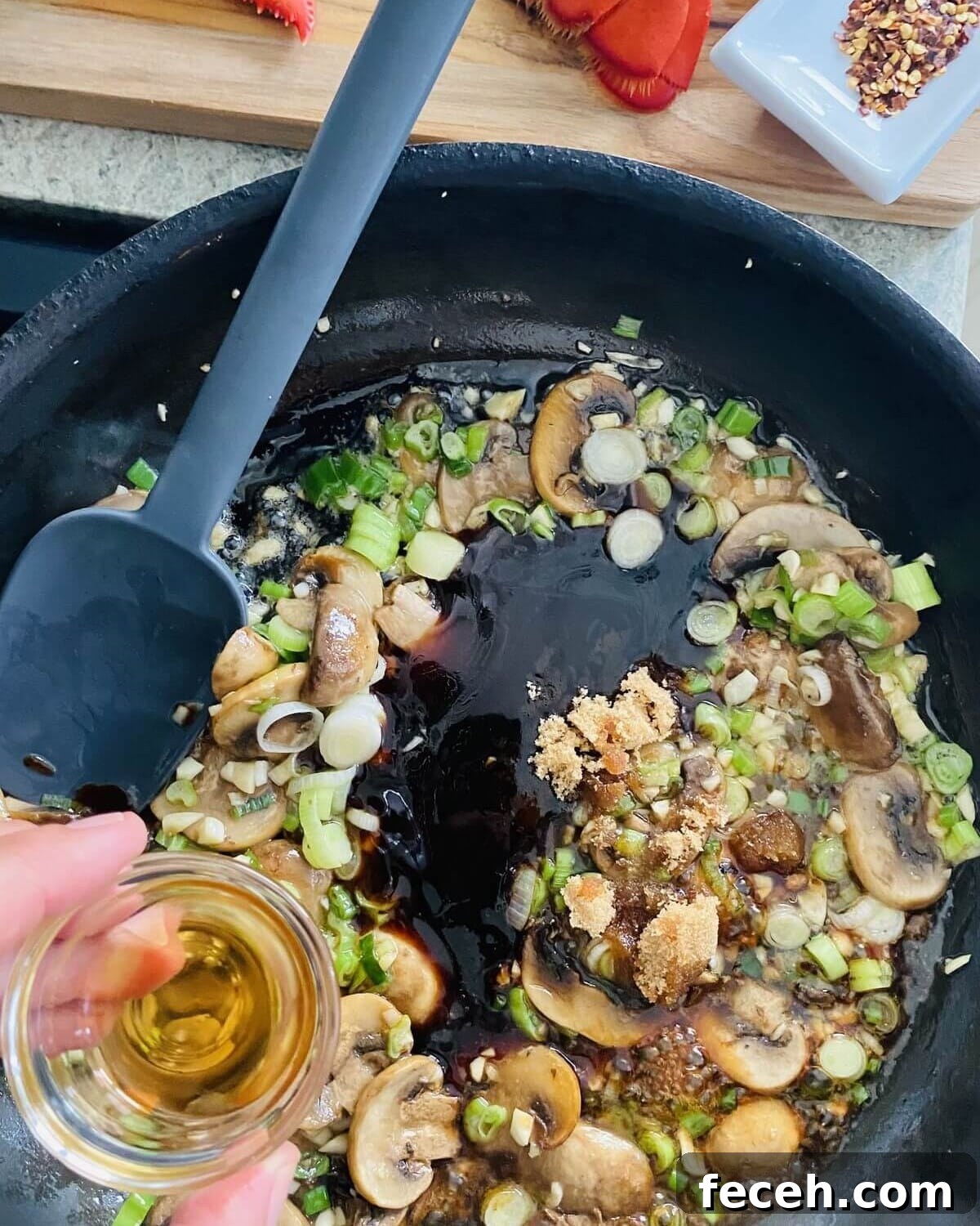 Adding oyster sauce and seasonings.