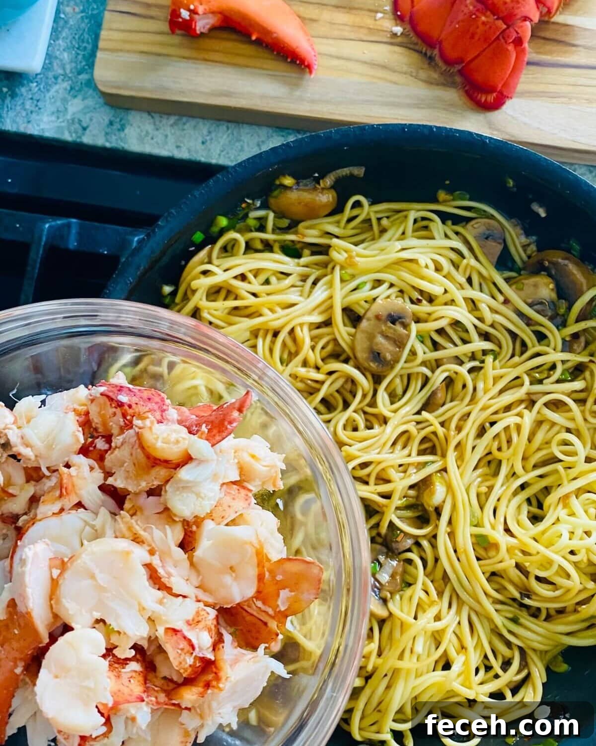 Adding lobster to noodles.