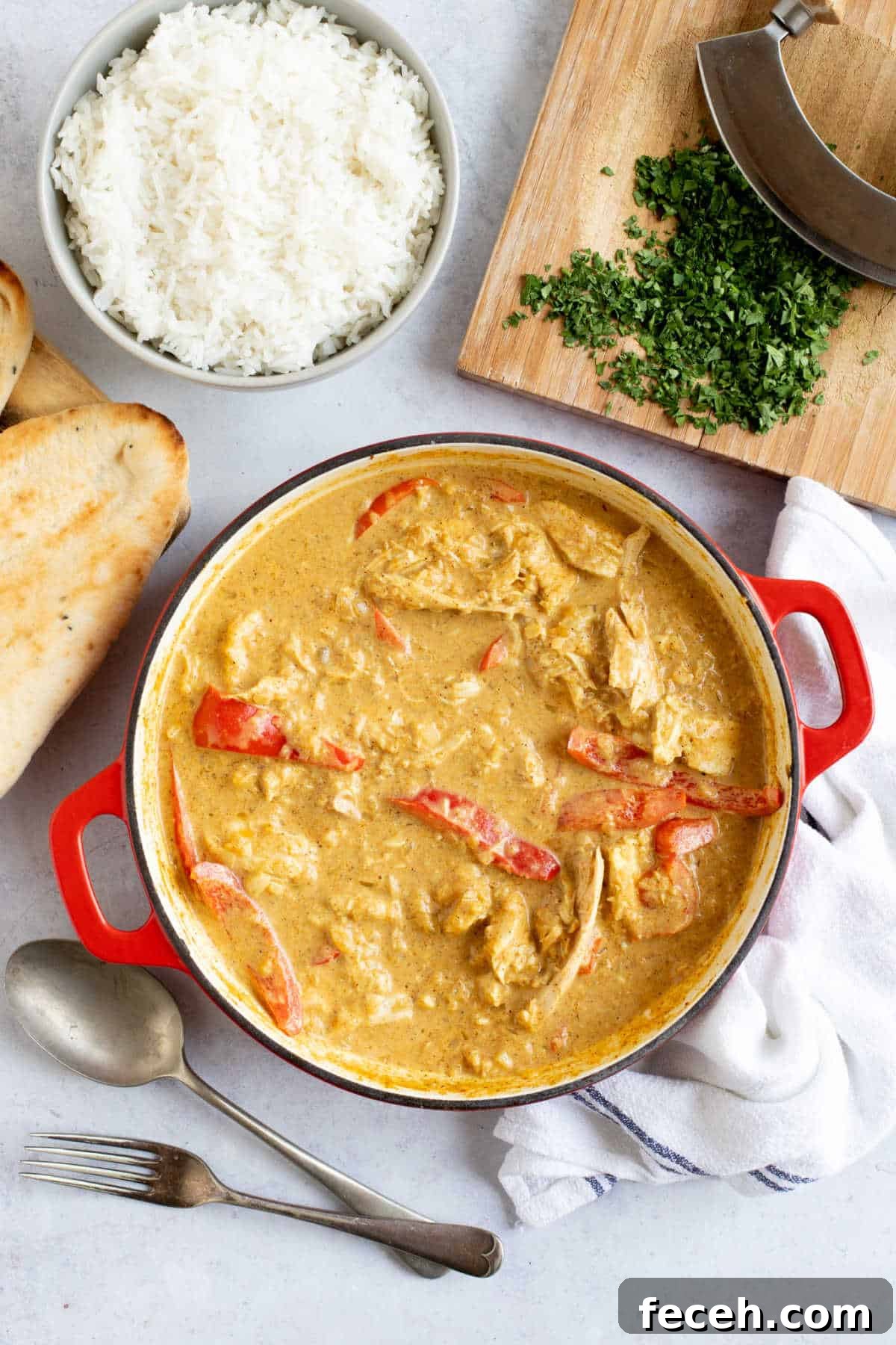 Revived Leftover Chicken Curry: Flavorful Makeover Recipe 2 Leftover roast chicken curry with red peppers in a red pan.