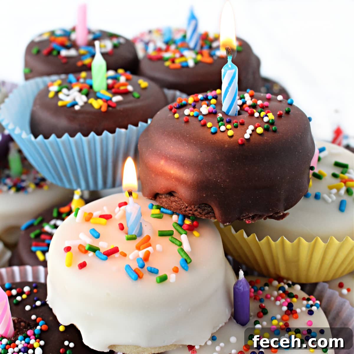 Birthday Cake Cookie Recipe: Soft, Sprinkle-Stuffed Treats 7 Closeup of cookie cakes with lit birthday candles.