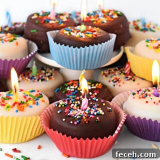 Birthday Cake Cookie Recipe: Soft, Sprinkle-Stuffed Treats 8 Birthday Cake Cookies topped with chocolate glaze, sprinkles, and lit candle.