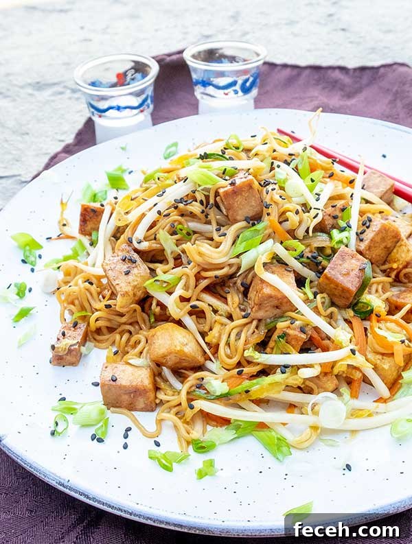 vegan chow mein with tofu on a plate, gluten free