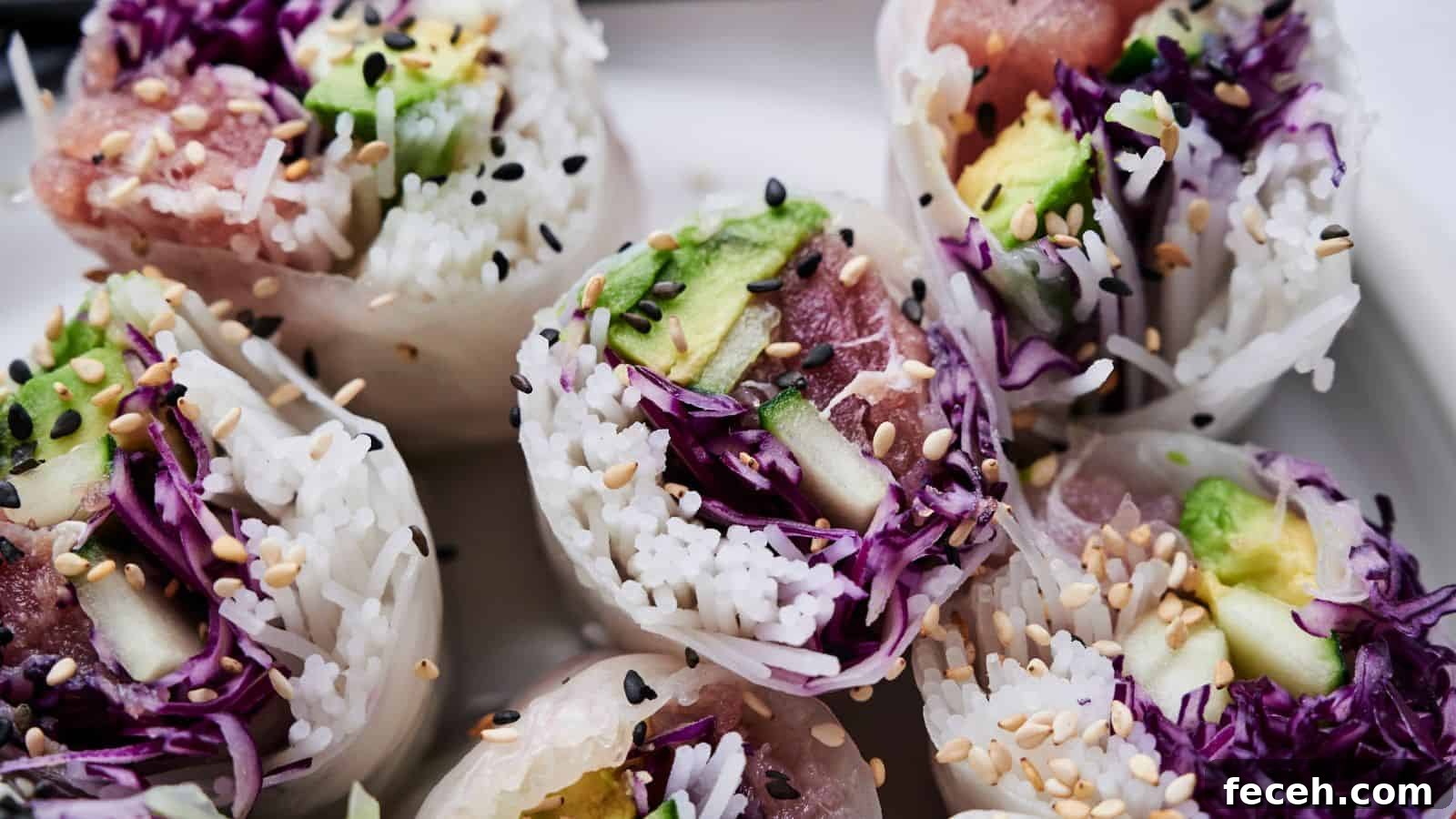 31 Asian Weeknight Dinners to Make Mealtime Exciting 17 Close-up of sliced spring rolls filled with rice, avocado, purple cabbage, and sesame seeds, arranged on a white plate.