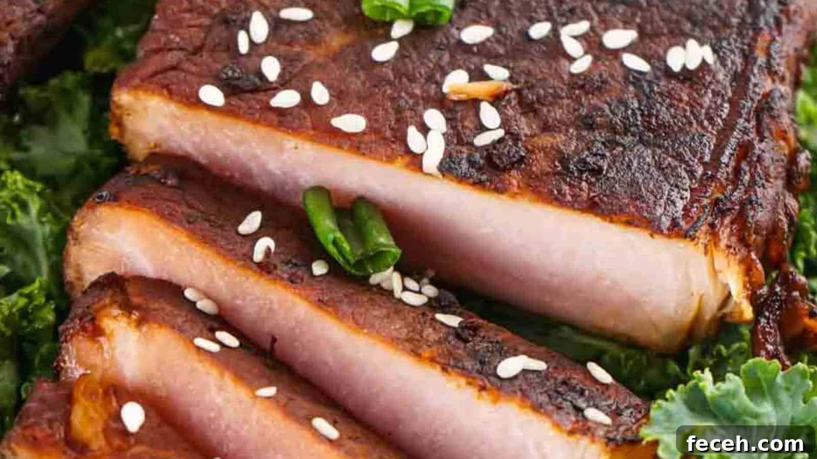 31 Asian Weeknight Dinners to Make Mealtime Exciting 31 Close-up of sliced grilled pork belly garnished with sesame seeds and green chili, served on a bed of kale.