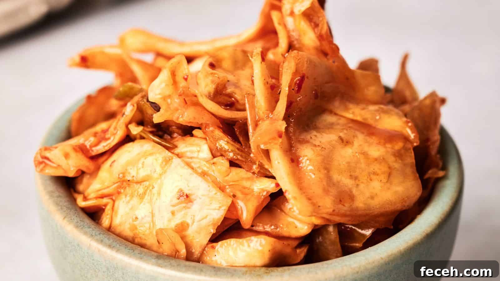 31 Asian Weeknight Dinners to Make Mealtime Exciting 32 A bowl of spicy, pickled kimchi cabbage on a light-colored surface.