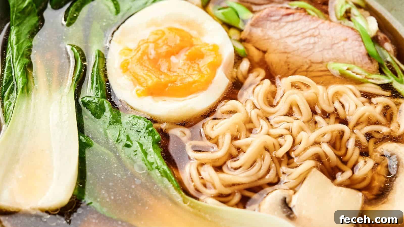 31 Asian Weeknight Dinners to Make Mealtime Exciting 8 Close-up of a bowl of ramen with noodles, a halved boiled egg, sliced meat, green leafy vegetables, and mushrooms in broth.