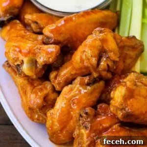 buffalo chicken wings stacked on a platter