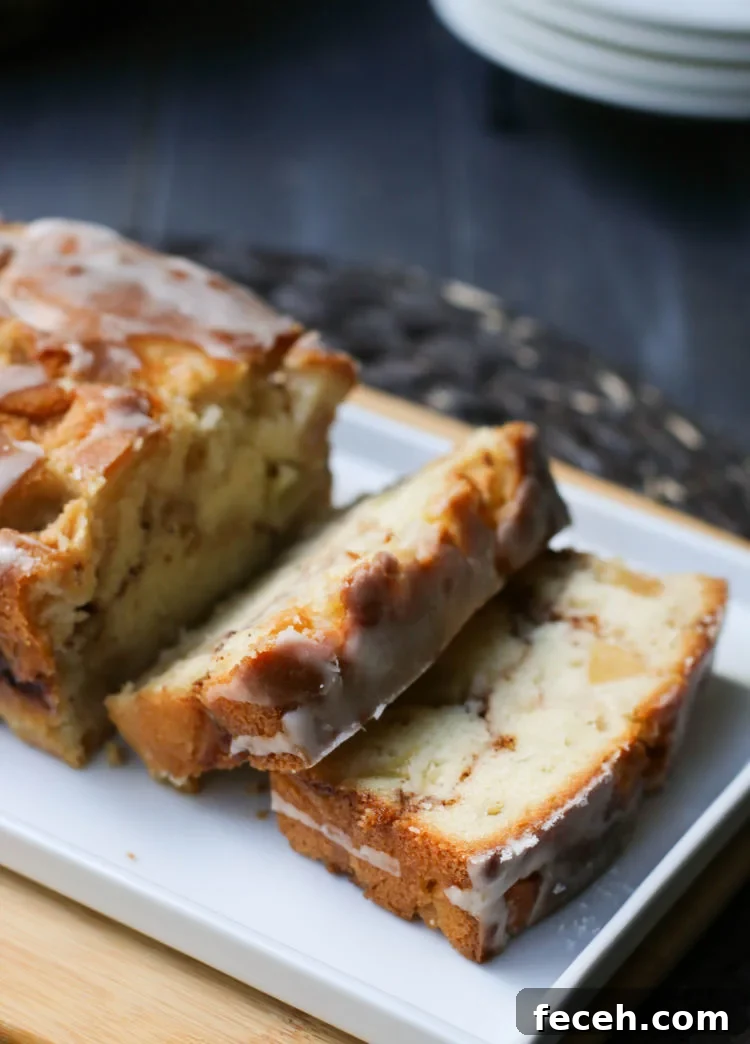 Close up of a loaf of Apple Fritter Bread with two slices cut