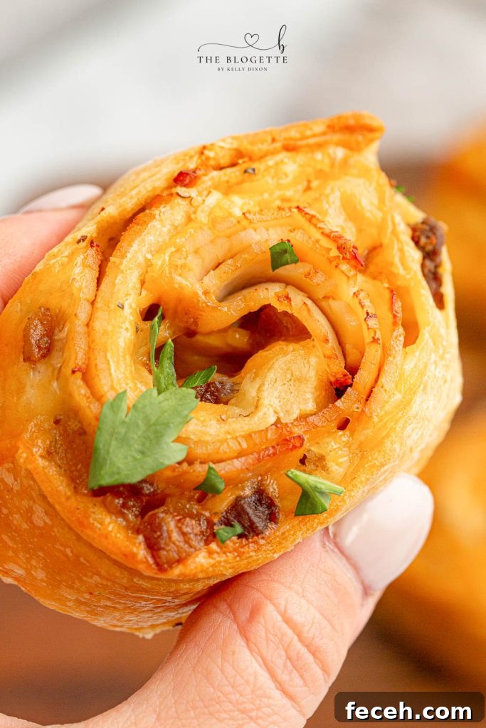 Baked Turkey and Cheese Rolls have melted cheese, bacon, and turkey covered in a garlic buttery glaze! The perfect party appetizer idea!