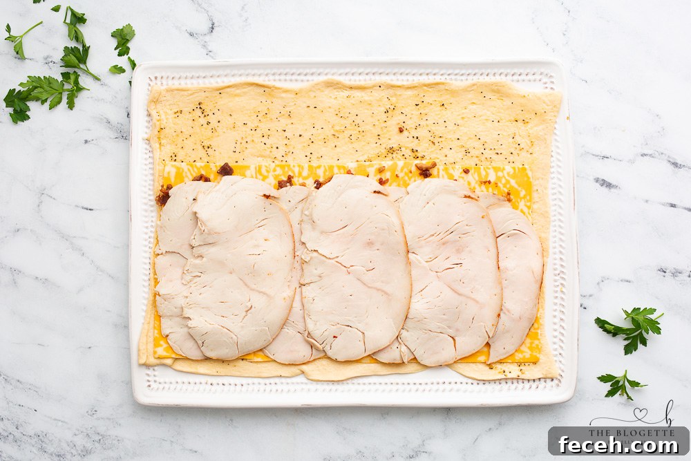 Bacon, cheese, and turkey on crescent dough