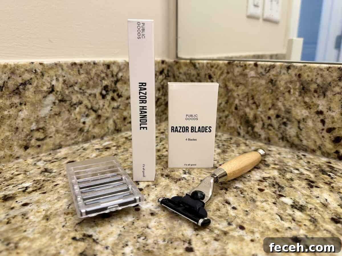 Are Public Goods Products Worth It? A Deep Dive Into Their Ingredients 6 A Public Goods razor set displayed on a granite bathroom countertop, including a wooden-handled razor, a box labeled “Razor Handle,” a box labeled “Razor Blades,” and a plastic case holding replacement blades.