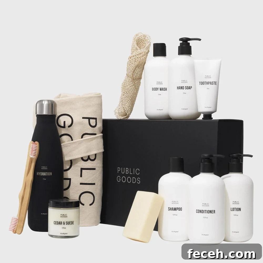 Are Public Goods Products Worth It? A Deep Dive Into Their Ingredients 8 The photo displays a variety of Public Goods personal care and home products, including a black water bottle, a canvas tote bag, bar soap, and various white bottles of shampoo and lotion, arranged around a black "PUBLIC GOODS" box.