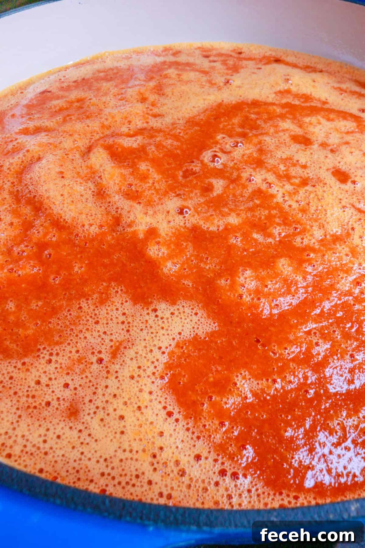 Sautéing chipotle sauce in a pot